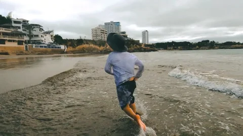 A boy running on the beach Stock Footage 280012753