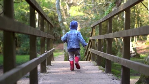 Boy running on the bridge Stock Footage 74803191