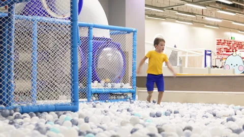Boy running to camera in playground. Video stock 264768286