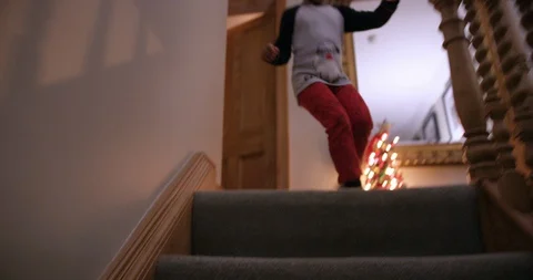 Boy running down stairs Stock Footage 129562318