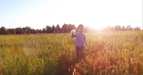 Boy Running with flowers. Romantic Stock Footage 108707810
