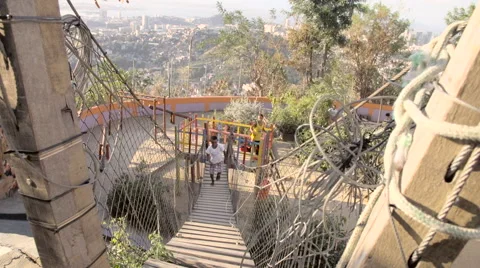 Boy running on footbridge Stock Footage 61292511