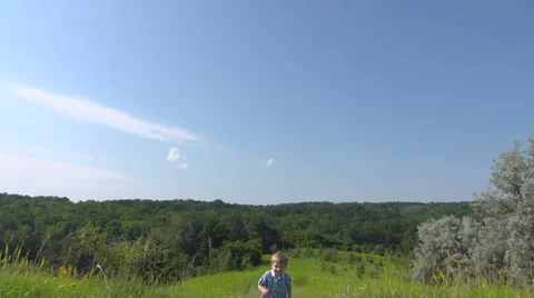 Boy running up the hill Stock-Footage 64709375