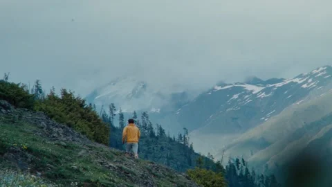 Boy Running up hills in the mountains Stock Footage 221857768