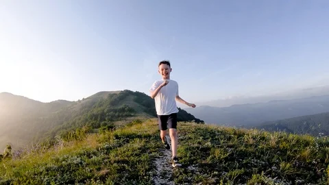 Boy Running in The Mountains. Stock Footage 109165607