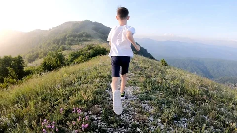 Boy Running in The Mountains. Stock Footage 109279001