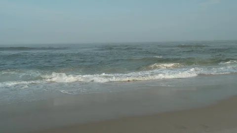 Boy running into Ocean water Stock Footage 95691109