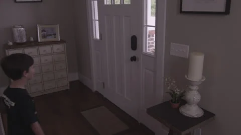 Boy Running Out the Door To Baseball Practice Stock Footage 25934389
