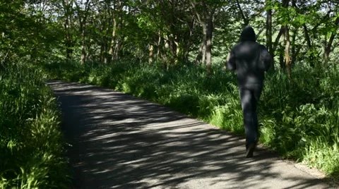 A boy running in a path (back view) Stock Footage 11115100