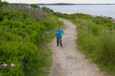 Boy Running on Path Stock Photos