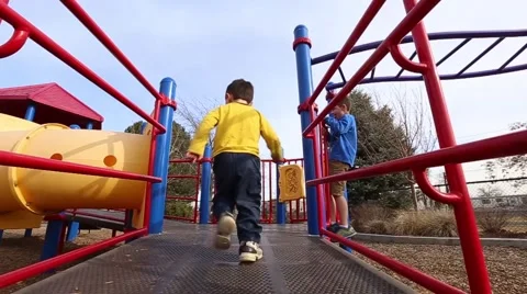Boy running on playground Stock Footage 50123863