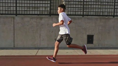 Boy Running On School Track Stockbeeldmateriaal 88439860