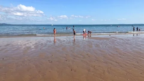 Boy running from sea. Stock Footage 160066581