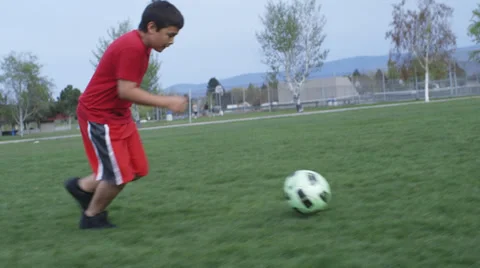 Boy running with soccer ball Stock Footage 37408756