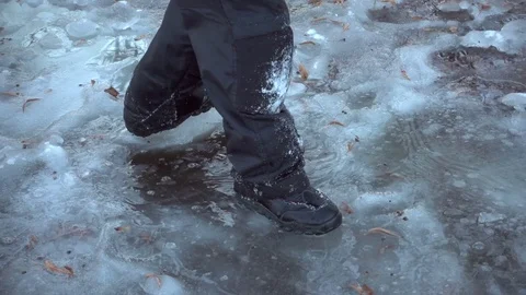 Boy running on thin ice, slow motion Stock Footage 70526719