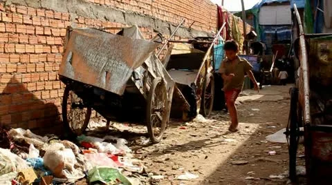 Boy Running Through Slum Video stock 12169127