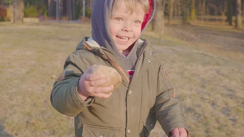 A boy is running through the woods. Portrait of a happy boy. Spring or autumn Video stock 105953072