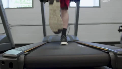 Boy Running on Treadmill Video stock 253194334