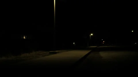 Boy Running Under A Streetlight While Dribbling A Basketball 스톡 동영상 148335155