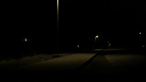 Boy Running Under A Streetlight While Dribbling A Basketball 스톡 동영상 148335207