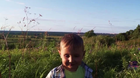 Boy Runs Around Park Pretending To Fly Stock Footage 71369204