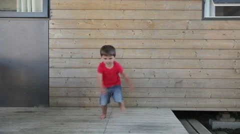Boy runs to camera Stock Footage 61250724