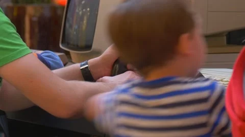 Boy Runs to Computer Which is Located on a Desk. Stock Footage 64328130