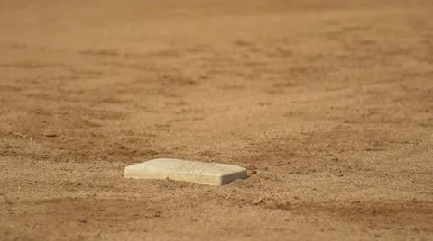 A boy runs to first base at little league baseball practice. Stock Footage 68576766