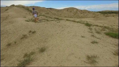A boy runs over the hill Stock Footage 85205340