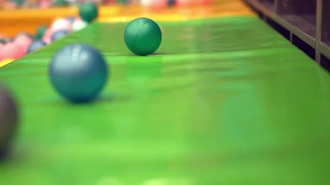 The boy runs over the pool with balls. Entertainment Center Stock Footage 180529329