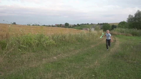 Boy runs with the plane Stock Footage 273577480