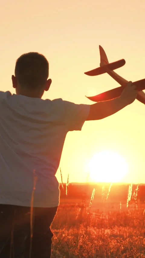 Boy runs with plane his hand, child boy plays with toy plane, child son runs Stock Footage 265716874