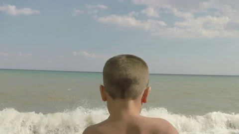 Boy runs to surf Stock Footage 72772784