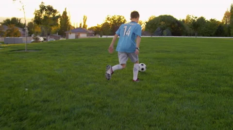 Boy Runs While Kicking Soccer Ball Stock Footage 68068870