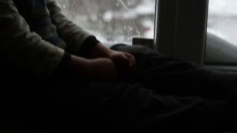 The boy said sitting at the window Stock Footage 75812007