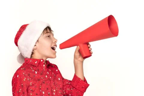 Boy in Santa hat holding red megaphone 스톡 사진