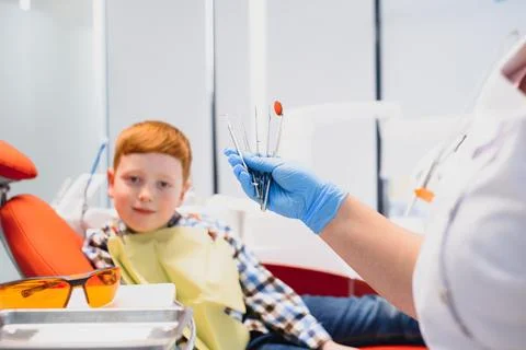 Boy satisfied with the service in the dental office. concept of pediatric d.. Stock Photos