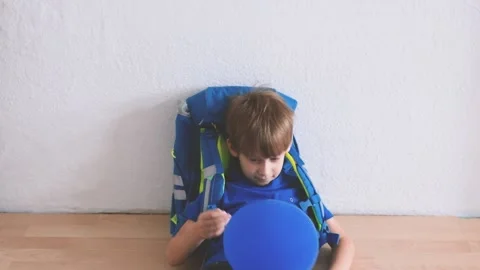 A boy with a school backpack on his back rejoices at the first day of school Stock Footage 205593069