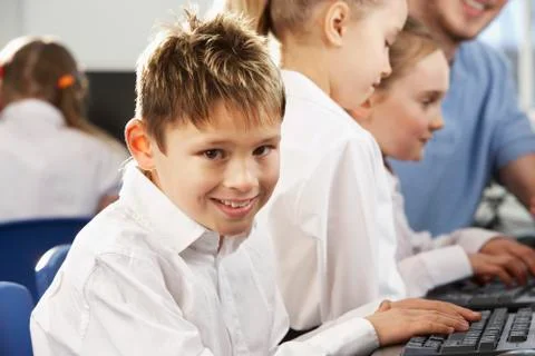 Boy in school class smiling to camera Foto stock