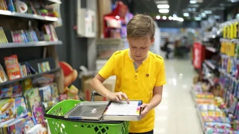 Boy in school store Stock Footage 135988040