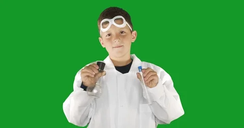 Boy scientist wearing white lab coat performing science experiment on background Stock Footage 118019807