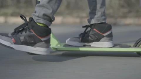 Boy on a scooter in a park  Stock-Footage 141513900