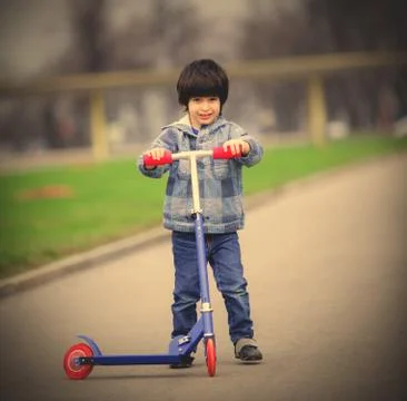 Boy with scooter Foto stock