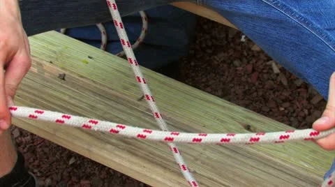 Boy Scout making a knot Stock Footage 10730991