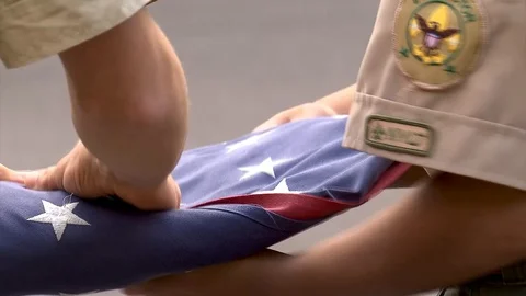 Boy Scouts folding up the American Flag Stock Footage 117409901
