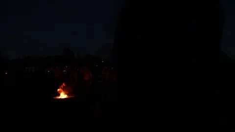 Boy scouts stand over burning flag Stock Footage 122357269