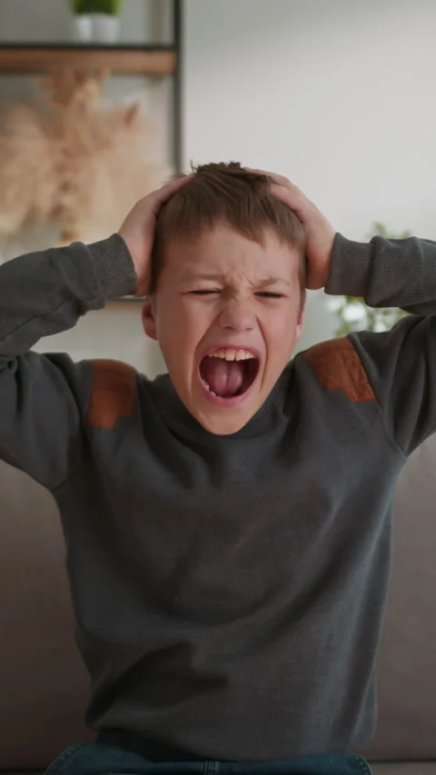 Boy Screaming in Frustration Stock Footage 335477316