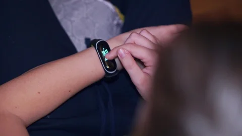 The boy scrolls through the menu in smart watch closeup Stock Footage 103552237