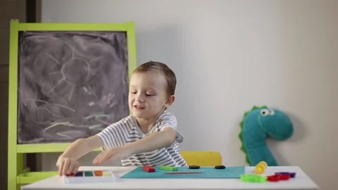 The boy sculpts from plasticine Stock Footage 220418803