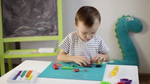 The boy sculpts from plasticine Stock Footage 220418807